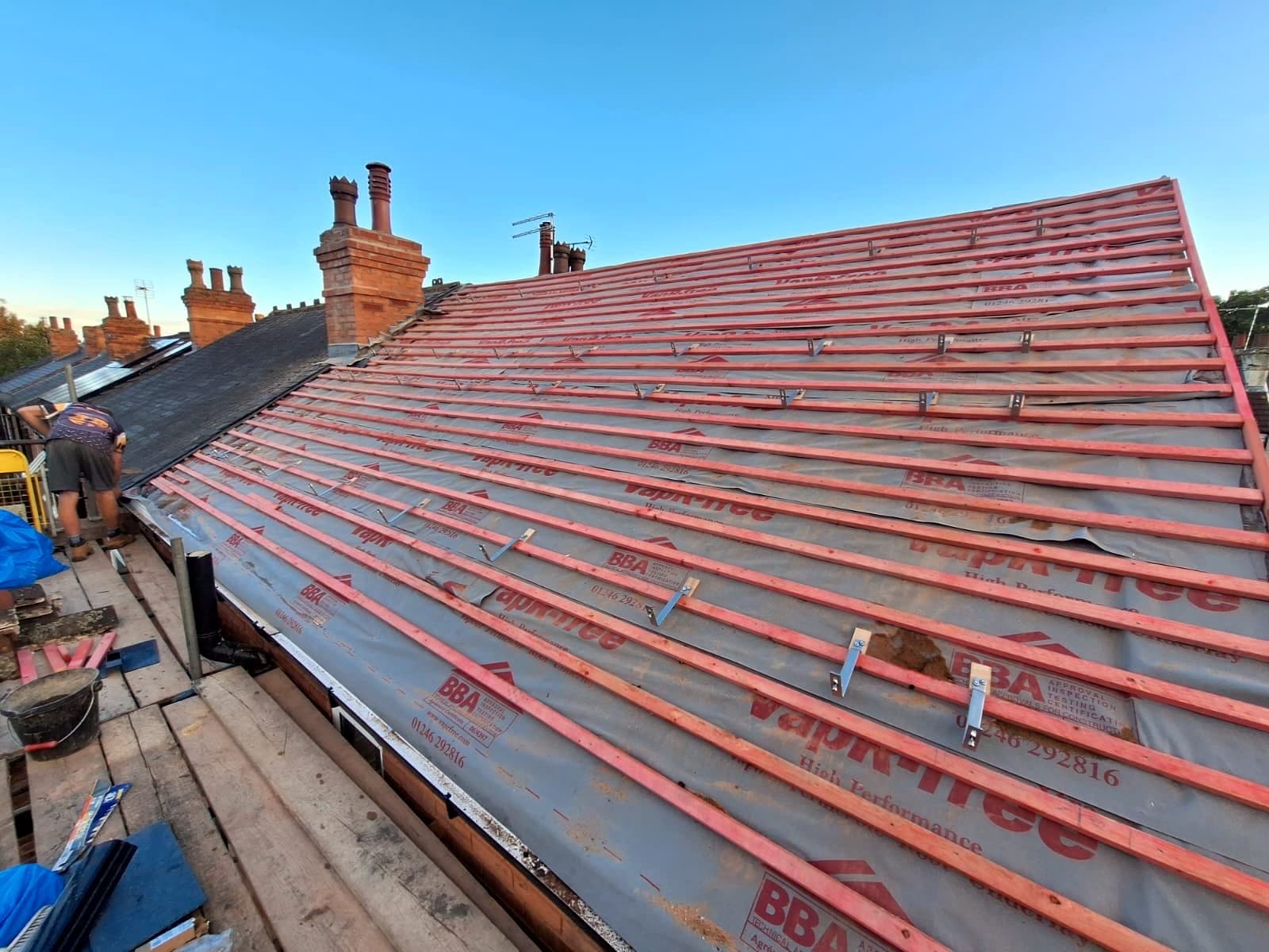 New breathable membrane and battens going on over a Nottingham terrace